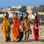 AI4WaterPolicy women carrying water from distant areas